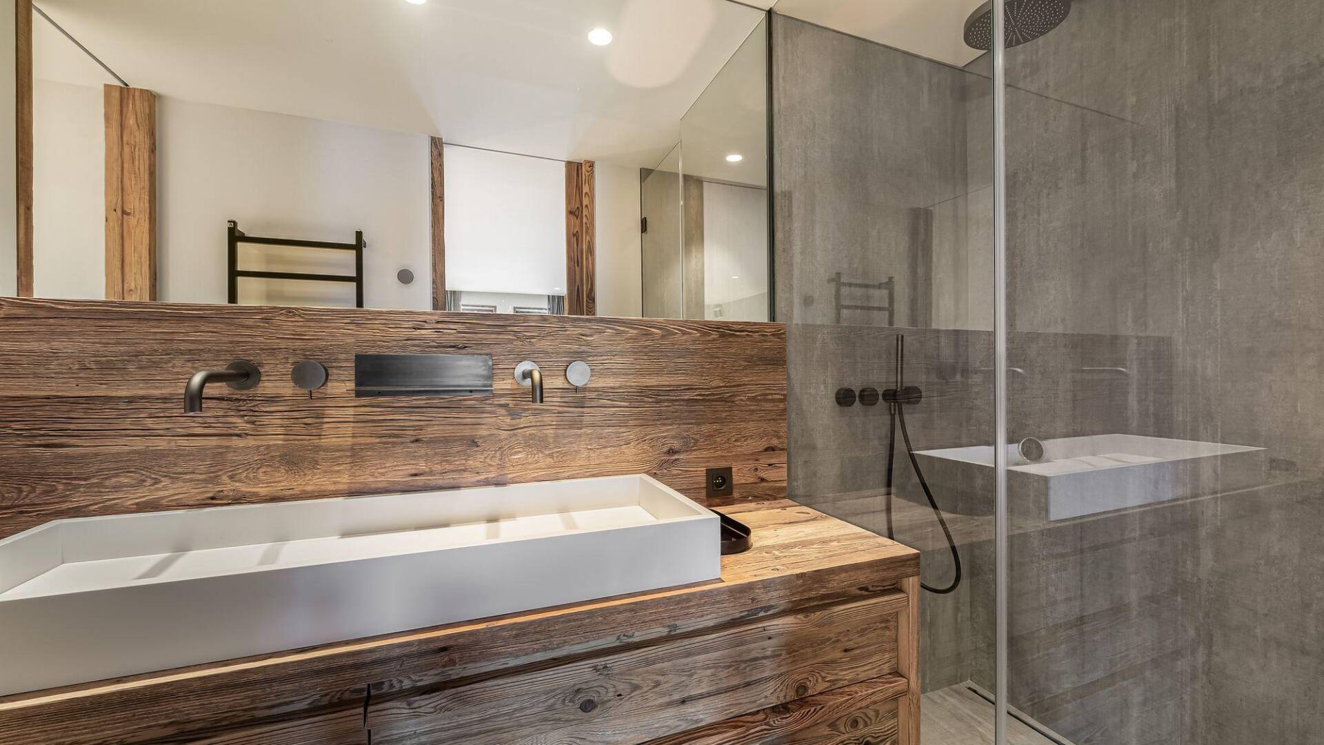 en suite bathroom with double hand basin and walk-in shower