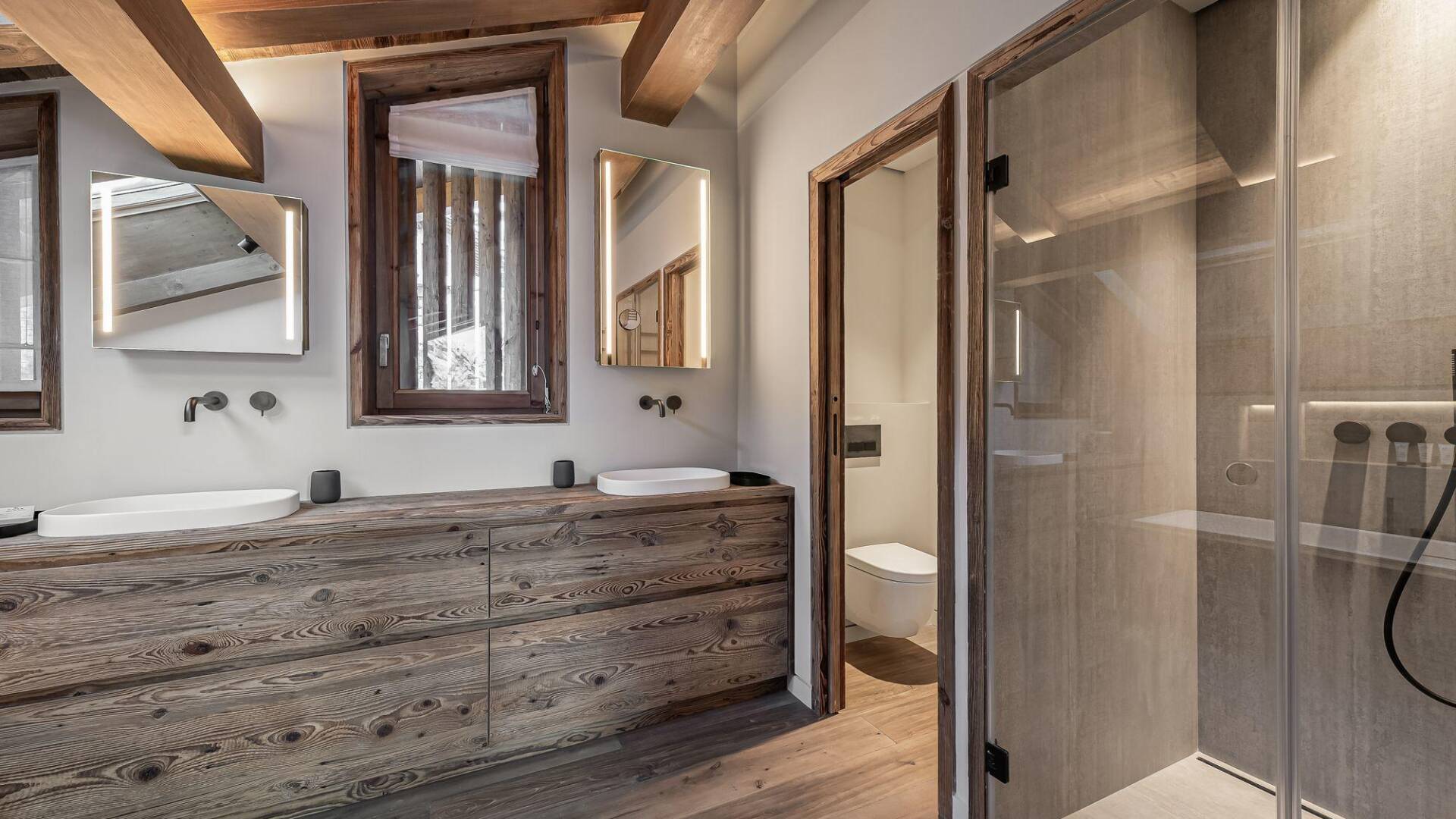 en suite bathroom with walk-in shower and double hand basin 