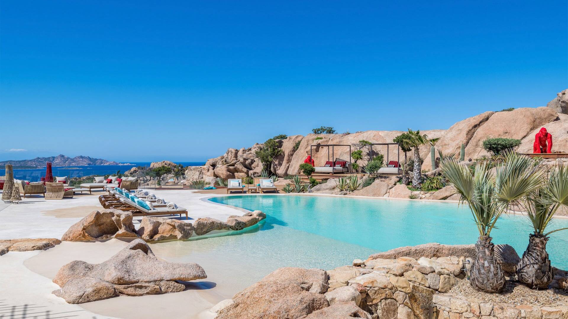 infinity pool with lounge areas and beautiful view
