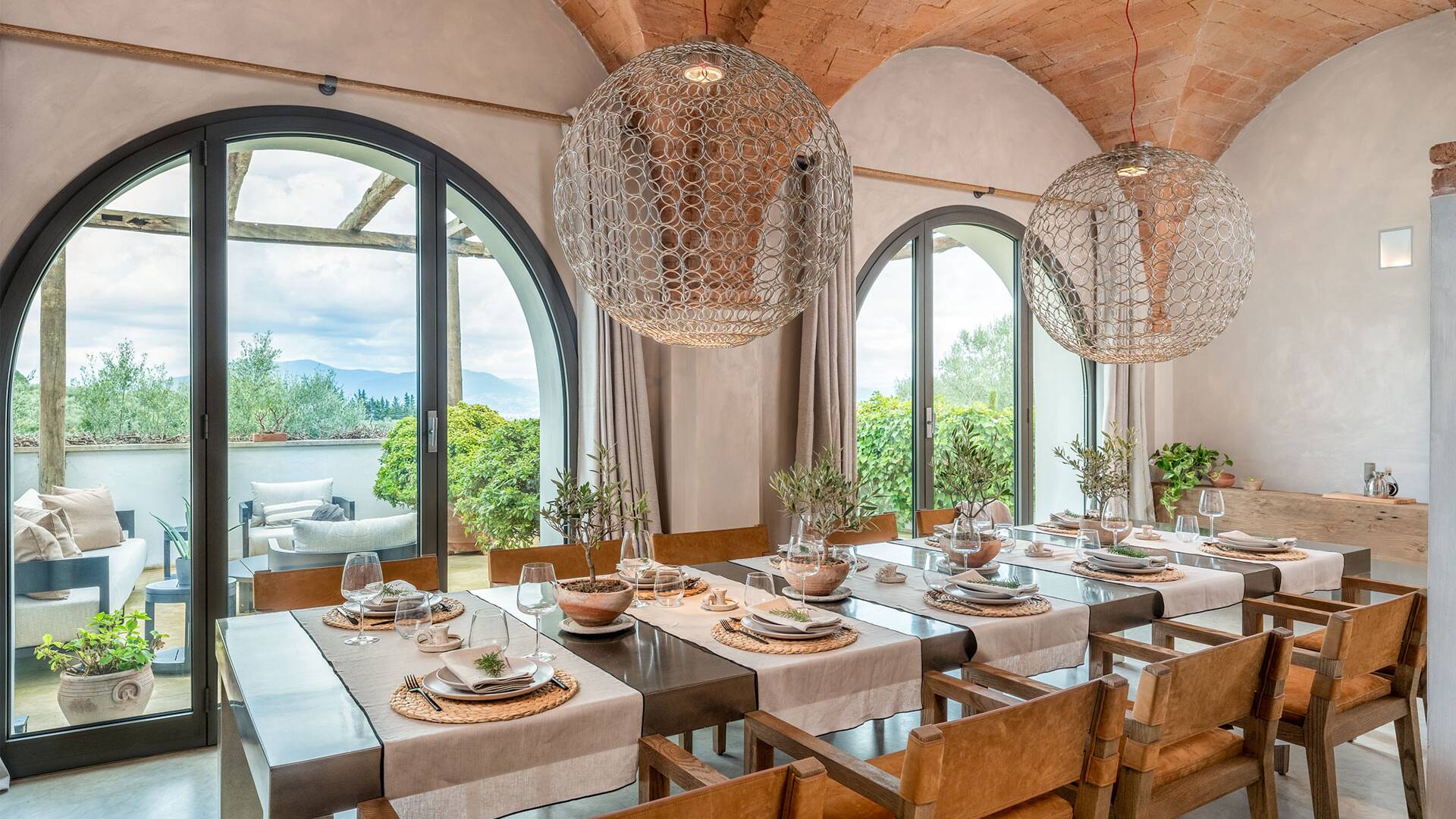 large dining table and arched windows