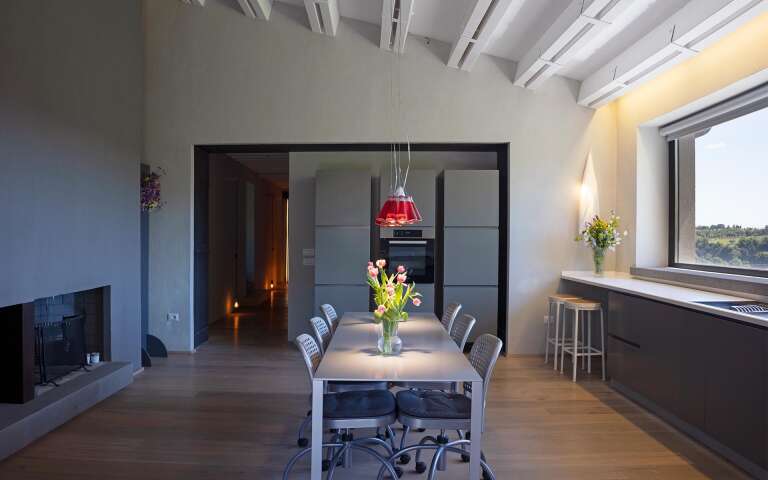 fully equipped kitchen with dining table