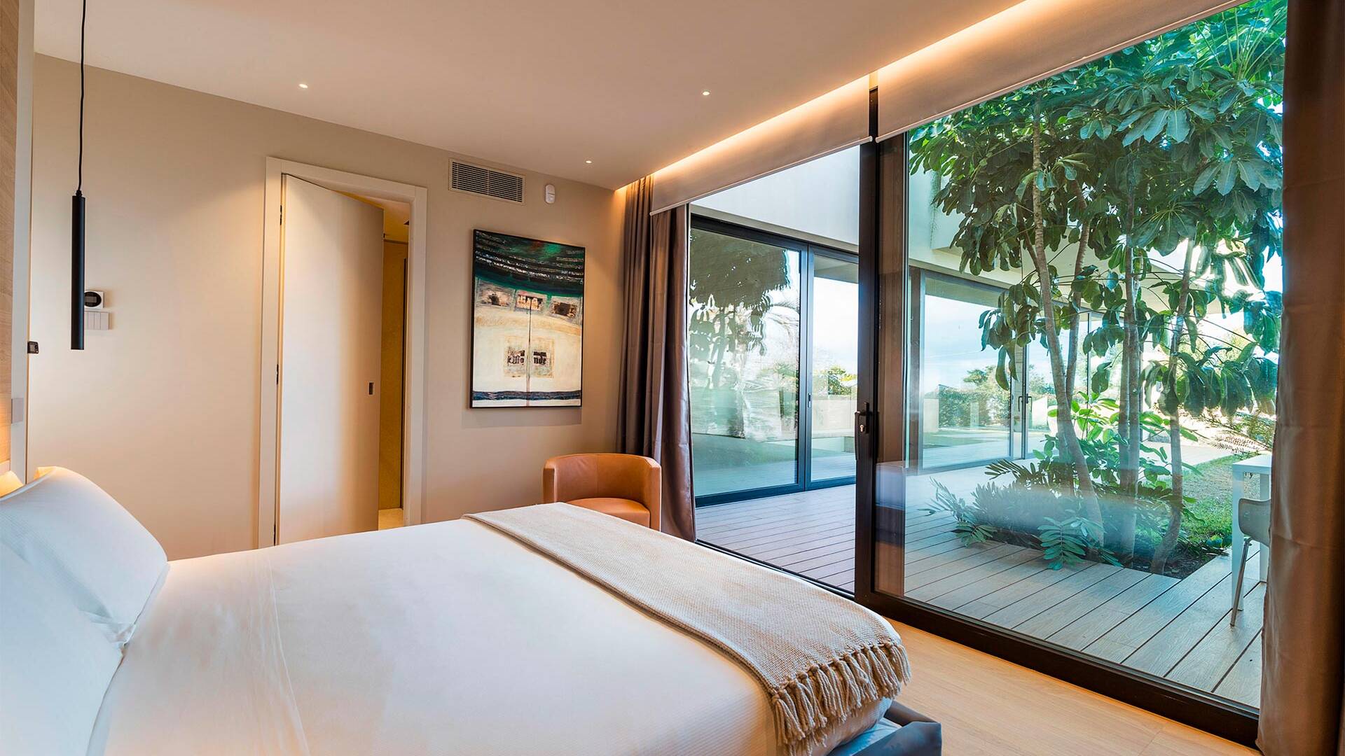 en suite double bedroom with outdoor access