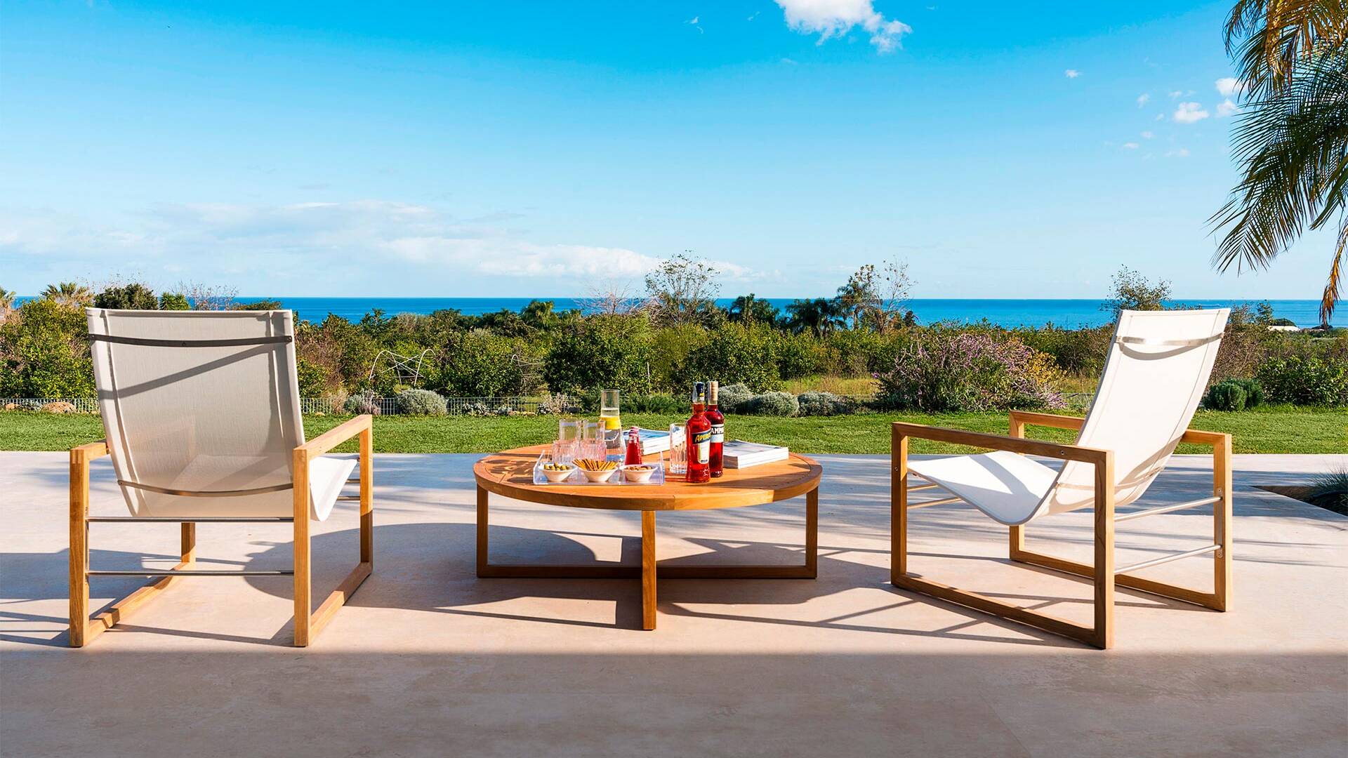 outdoor lounge space with beautiful view over the sea