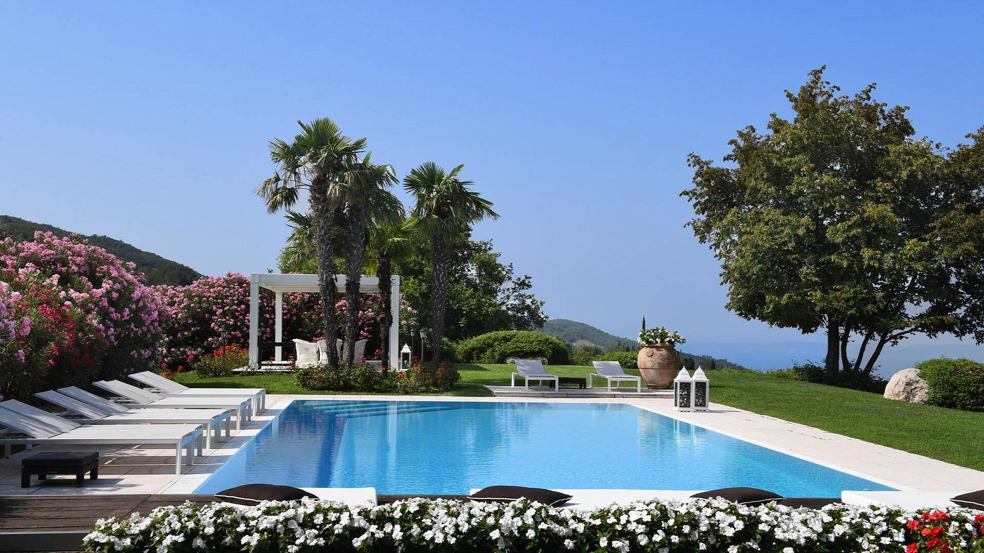 swimming pool area with panoramic views over Lake Garda