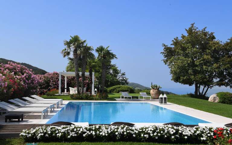 swimming pool area with panoramic views over Lake Garda