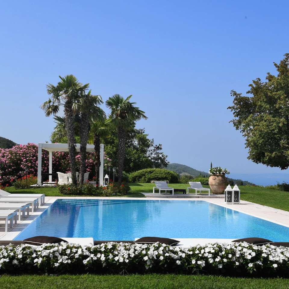 swimming pool area with panoramic views over Lake Garda