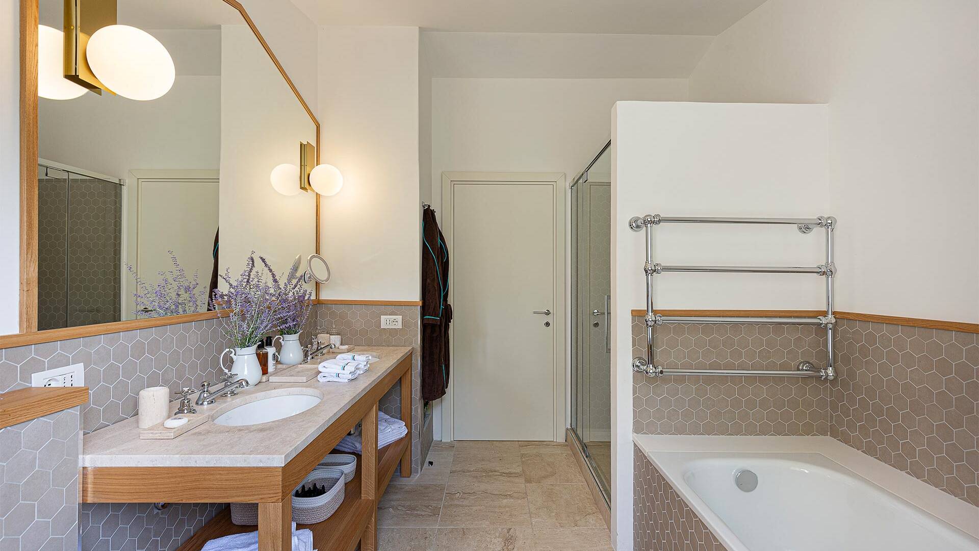 en suite bathroom with bath tub and shower