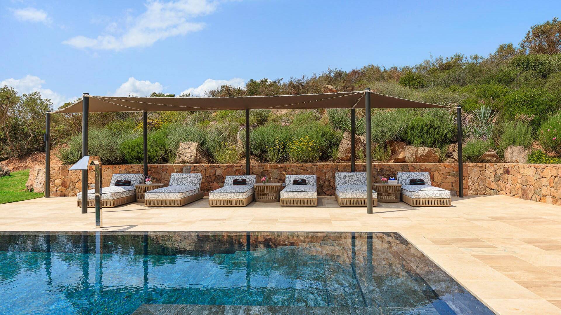 pergola with sunbeds