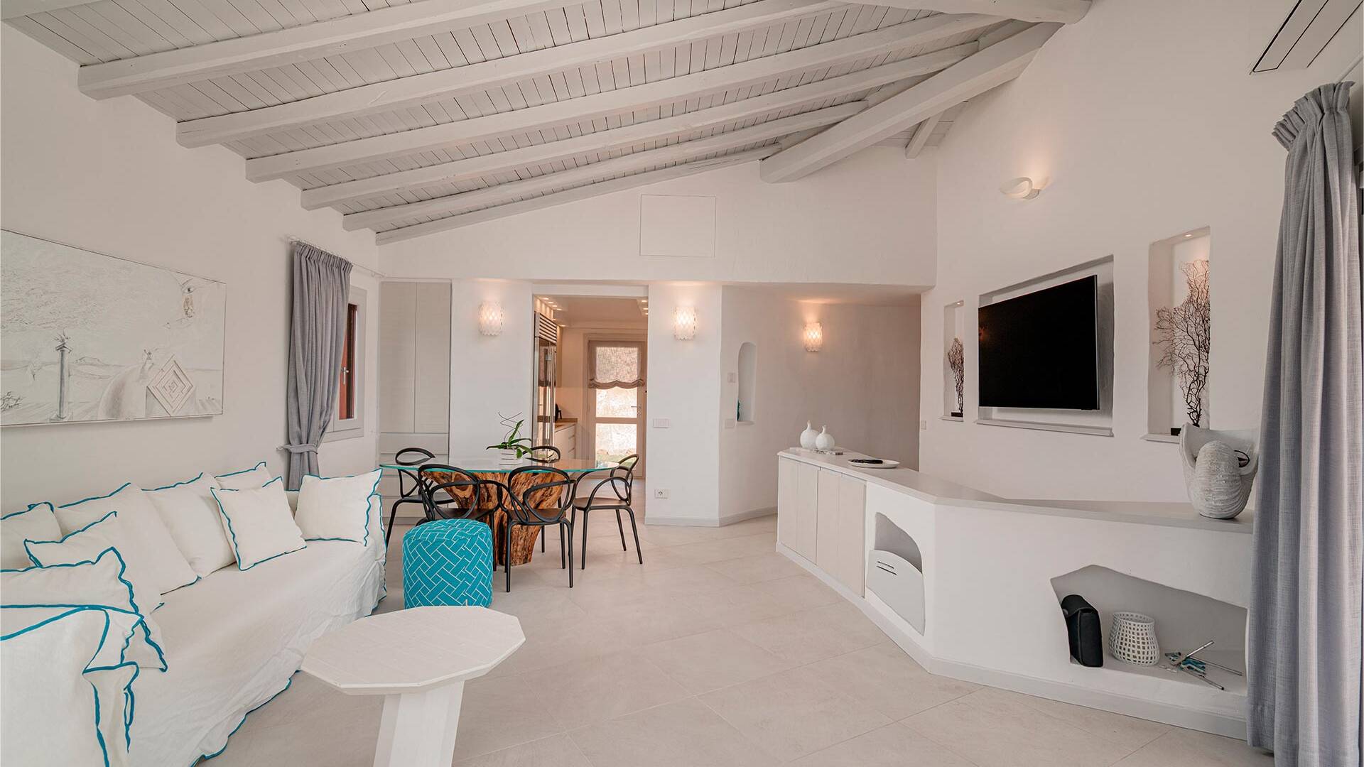 living room with television and dining table