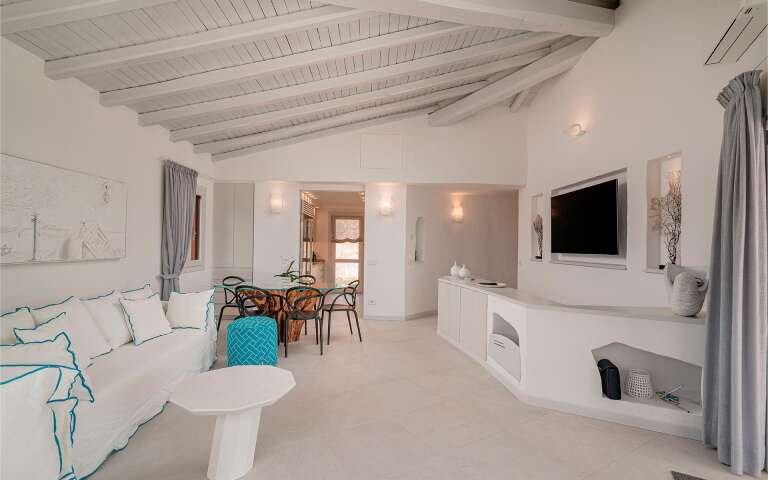 living room with television and dining table