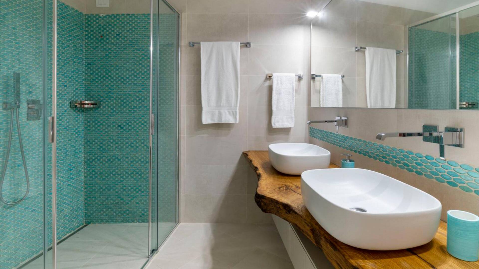 en suite bathroom with double sink and walk-in shower