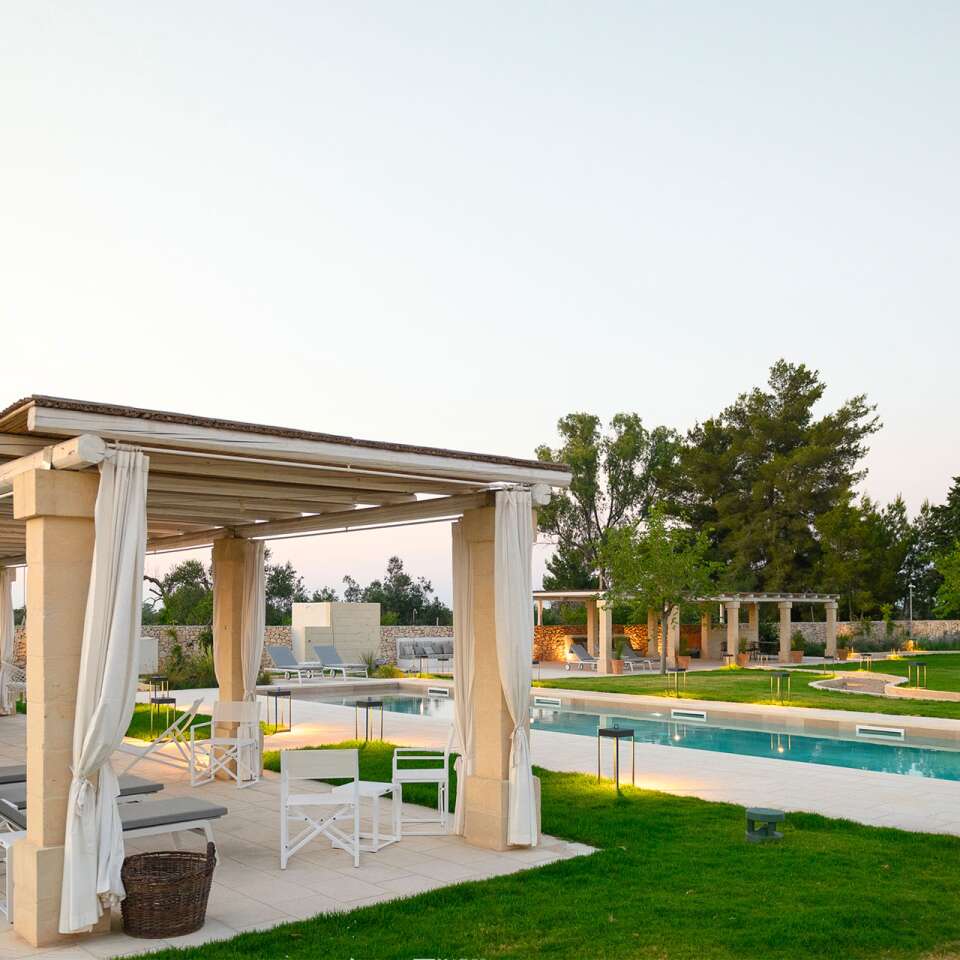 pool area with pergola and lounge area