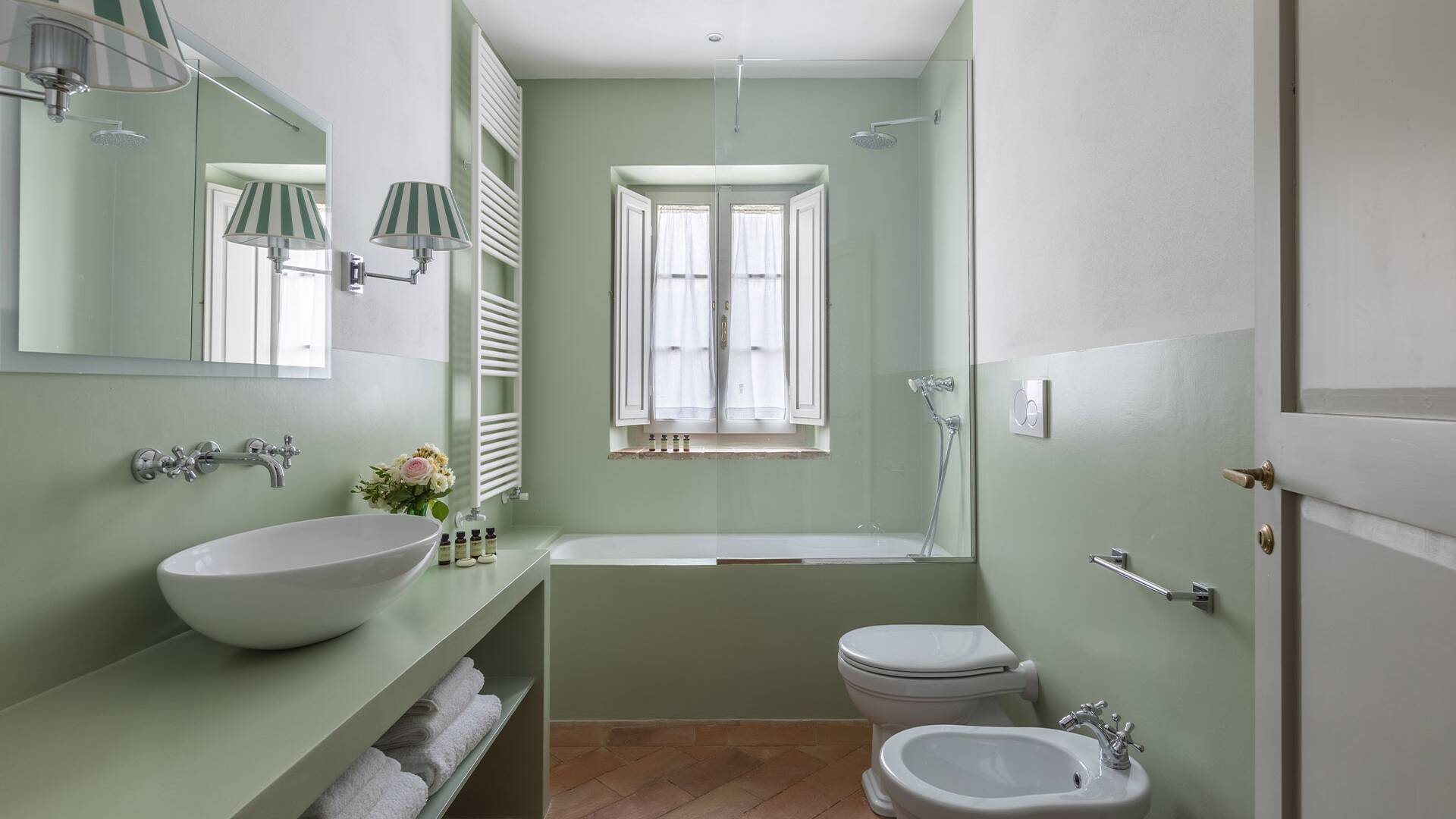 bathroom with bathtub and head shower