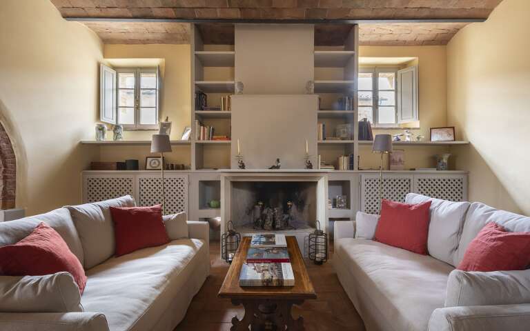 villa 1 living room with fireplace and comfortable sofa 