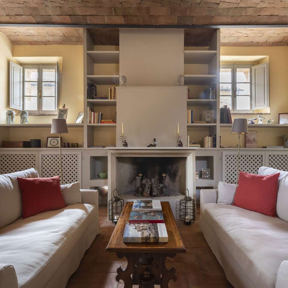 villa 1 living room with fireplace and comfortable sofa 