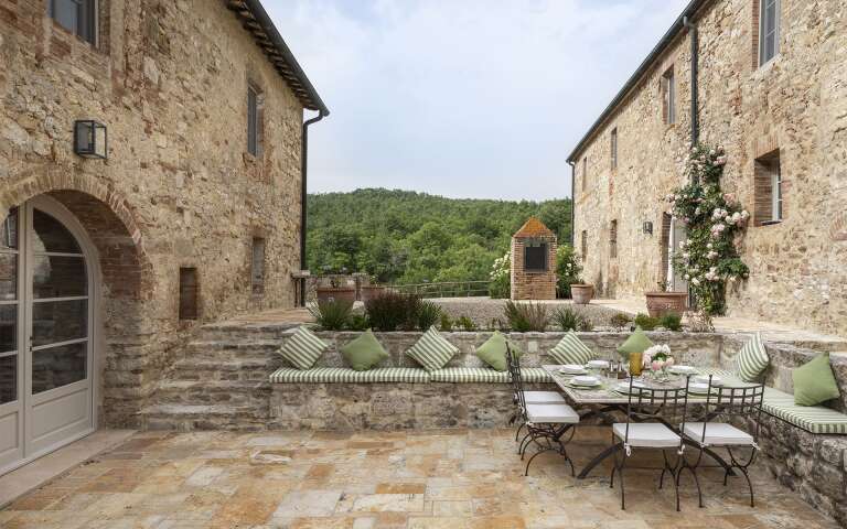 outdoor lounge area between the main villa and guest house