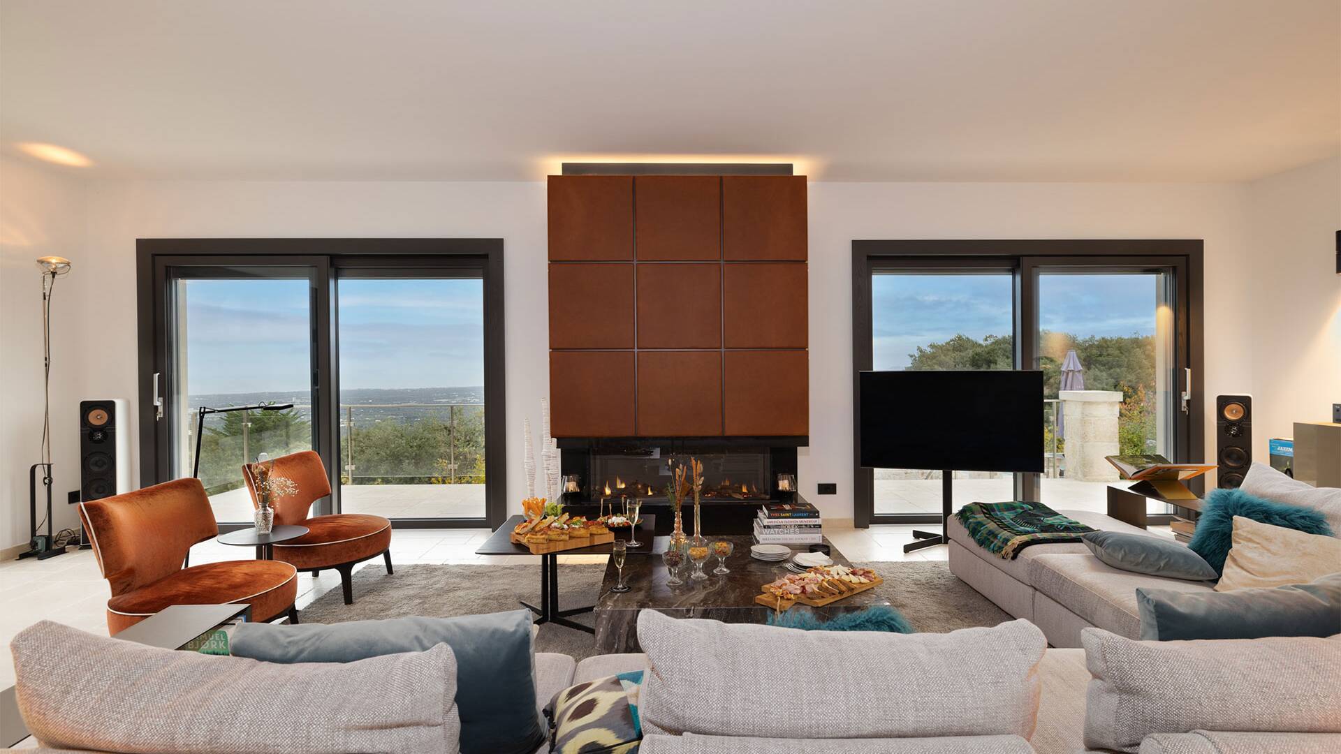 living room with fireplace, tv and comfortable large sofa