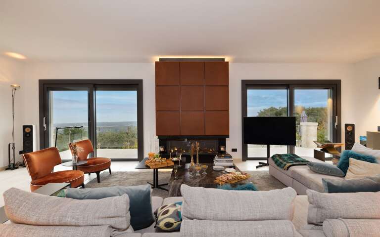 living room with fireplace, tv and comfortable large sofa