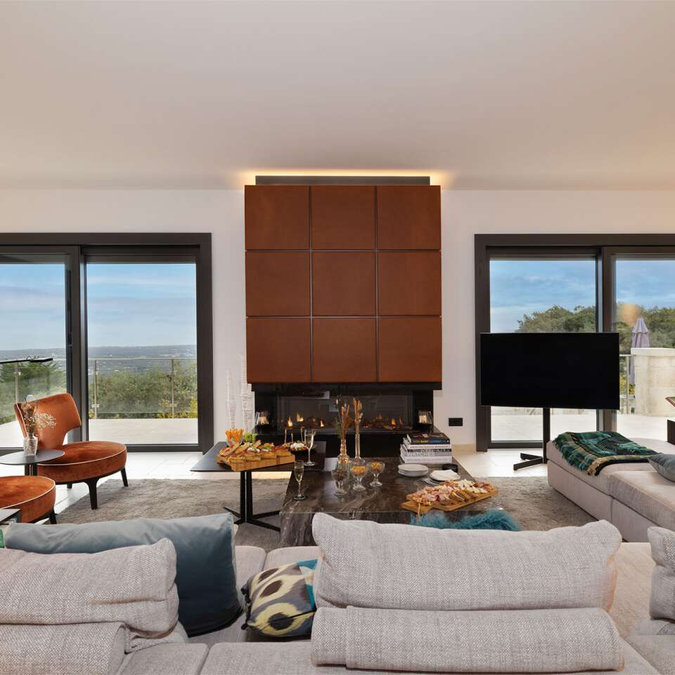 living room with fireplace, tv and comfortable large sofa