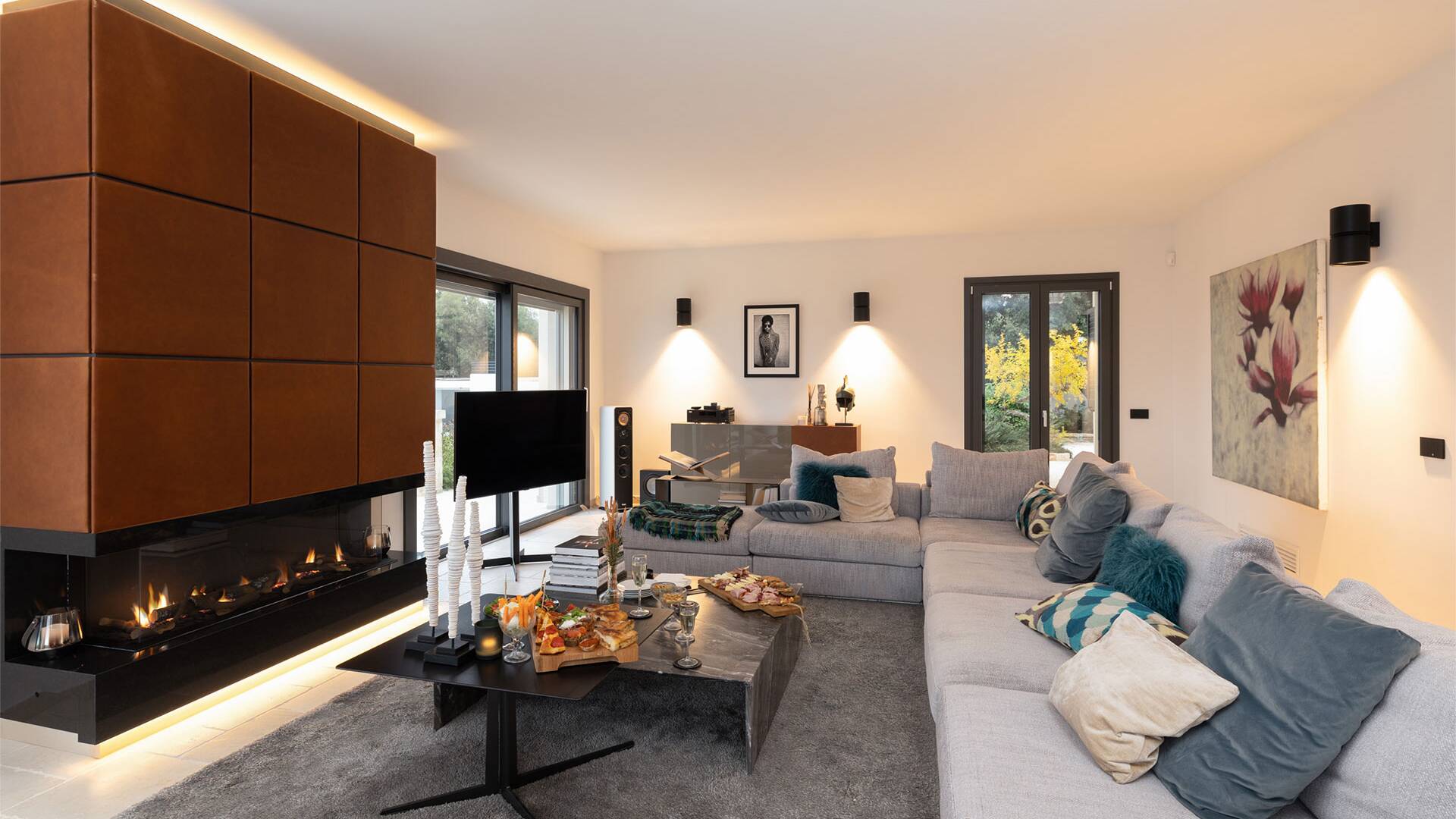 living room with fireplace, tv and comfortable large sofa