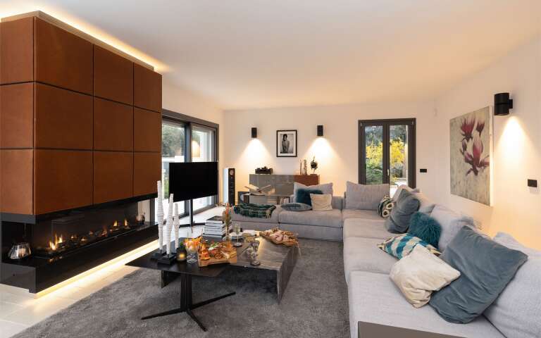 living room with fireplace, tv and comfortable large sofa