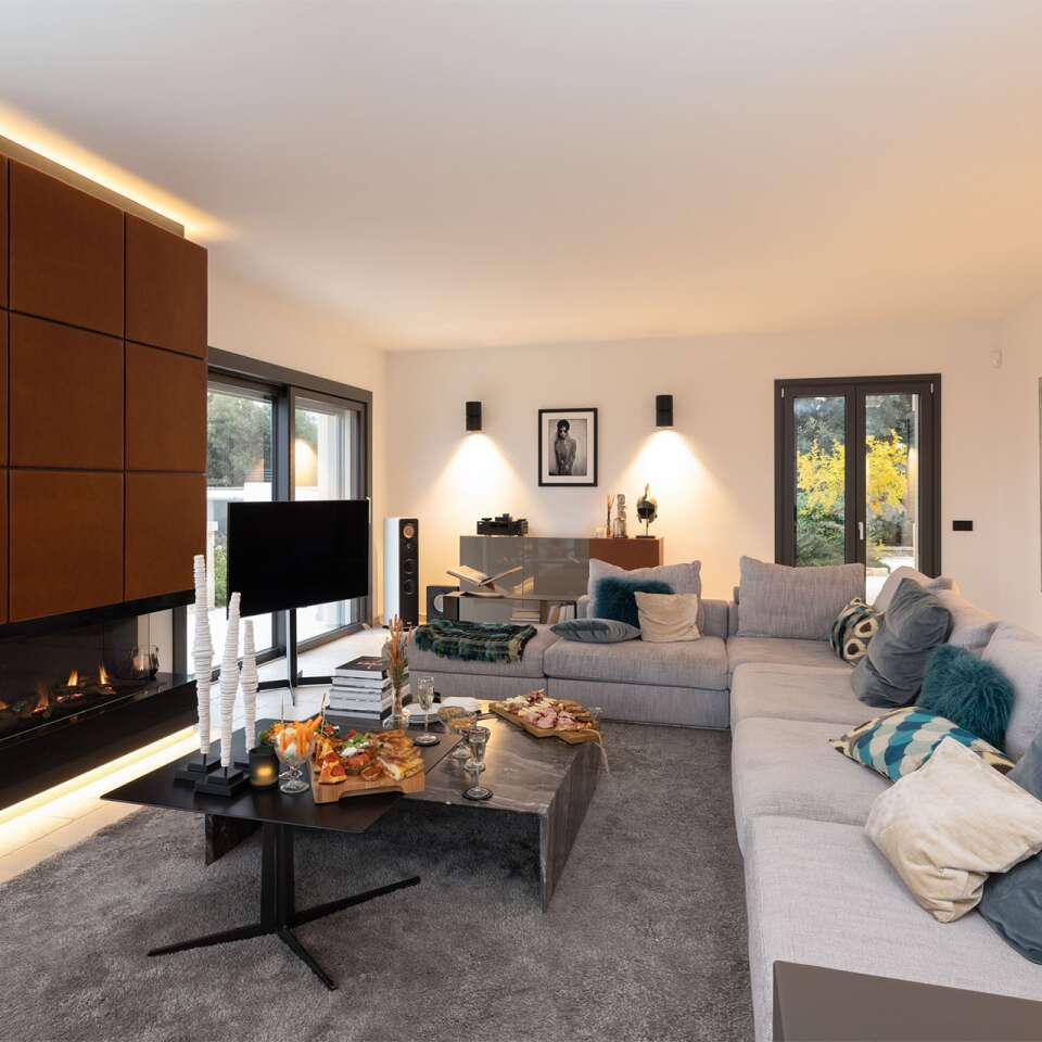 living room with fireplace, tv and comfortable large sofa