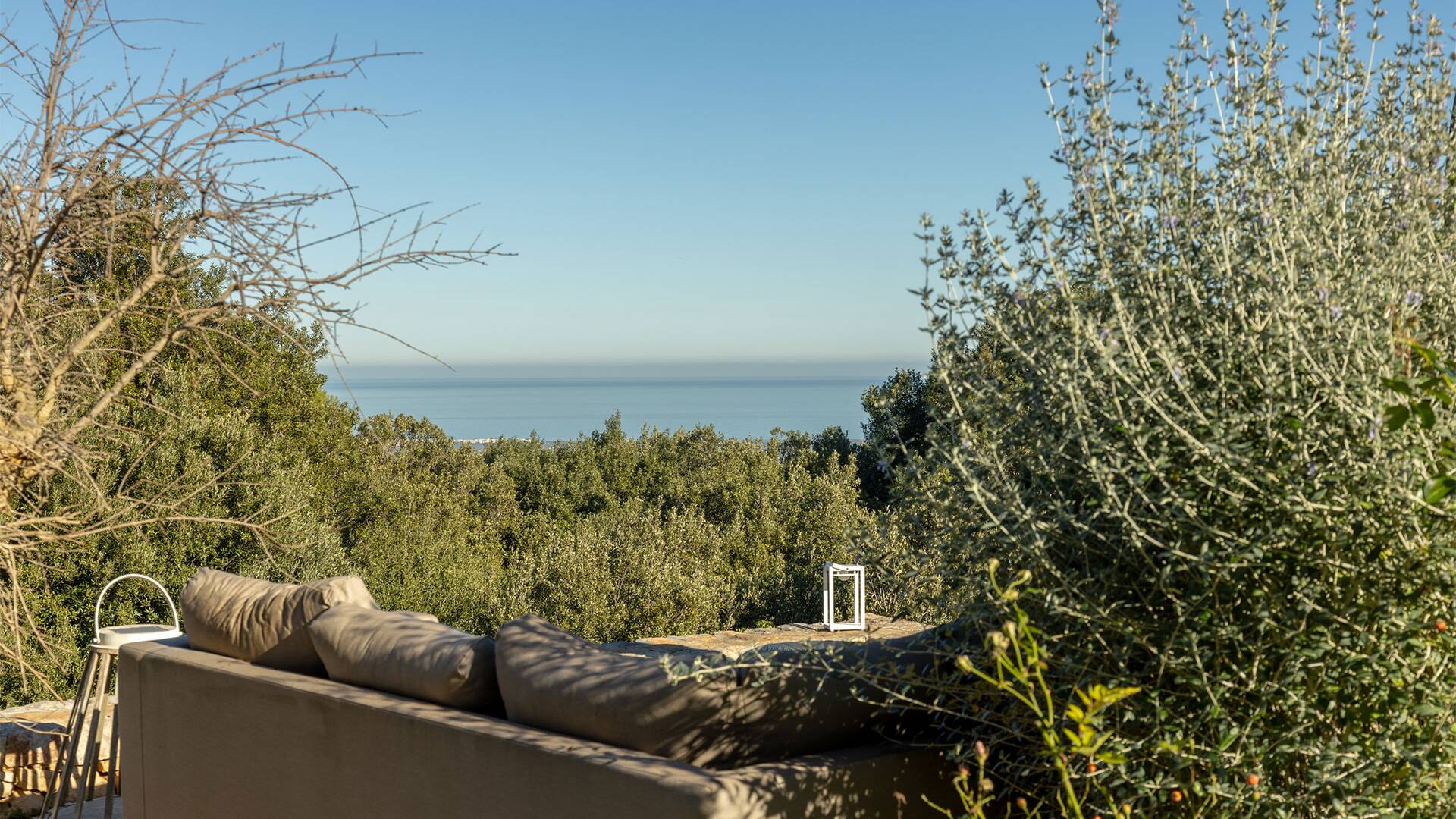 outdoor lounge area with view over the sea
