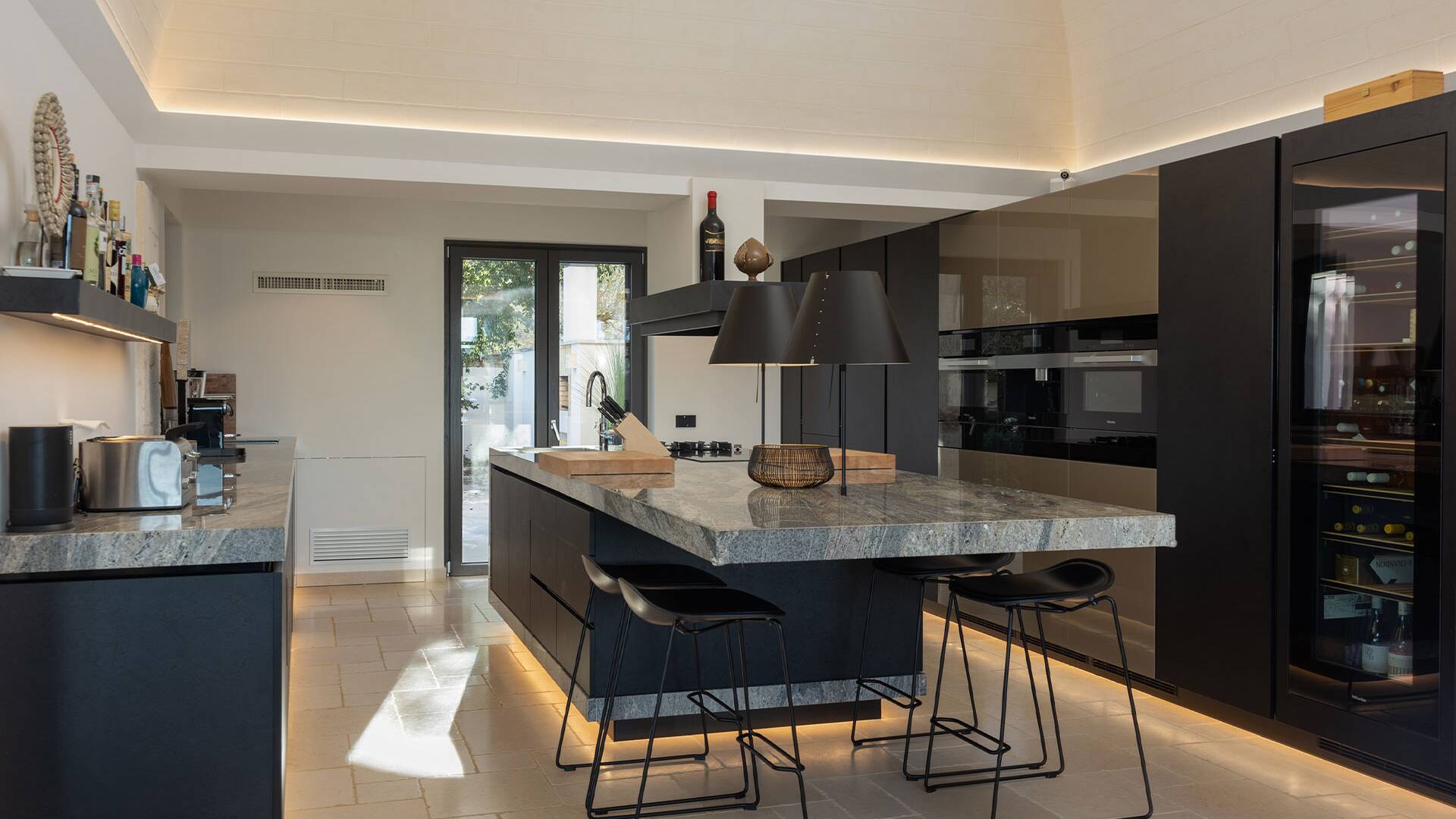 fully equipped kitchen with marble countertop