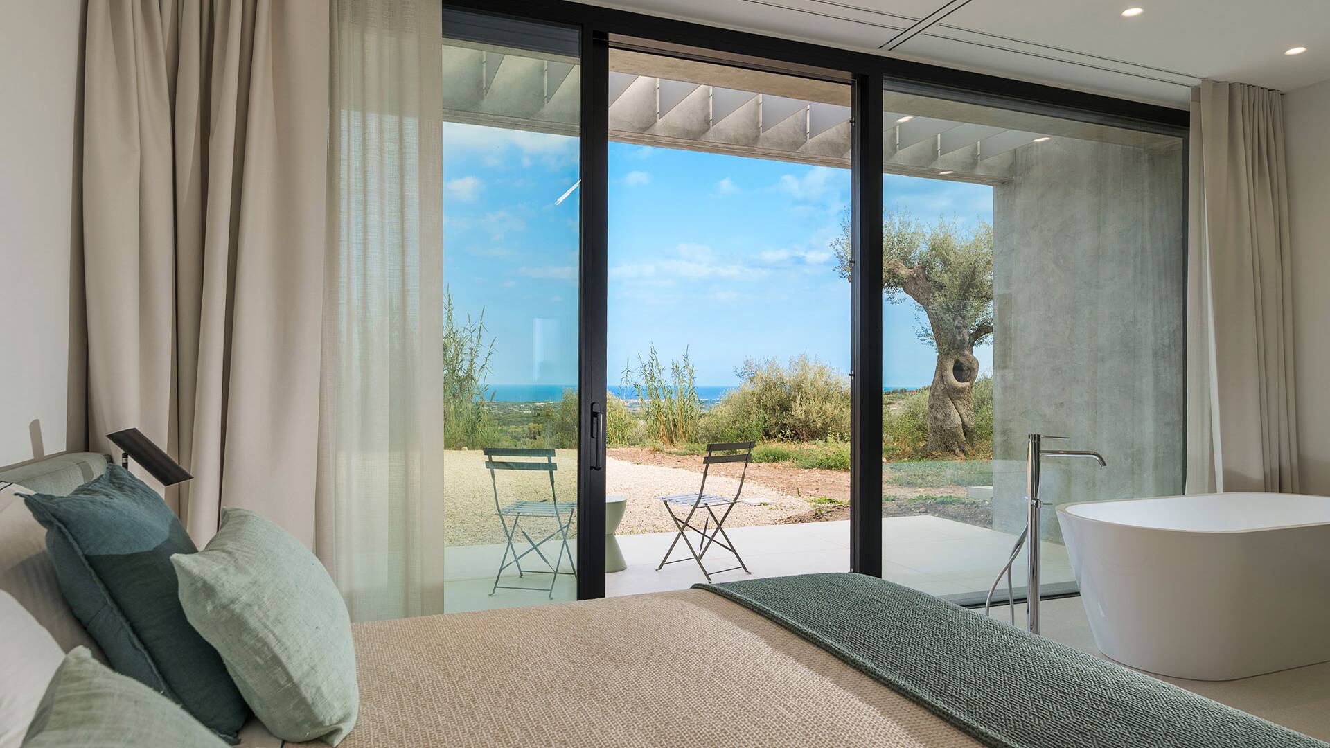 en suite double bedroom with bath tub