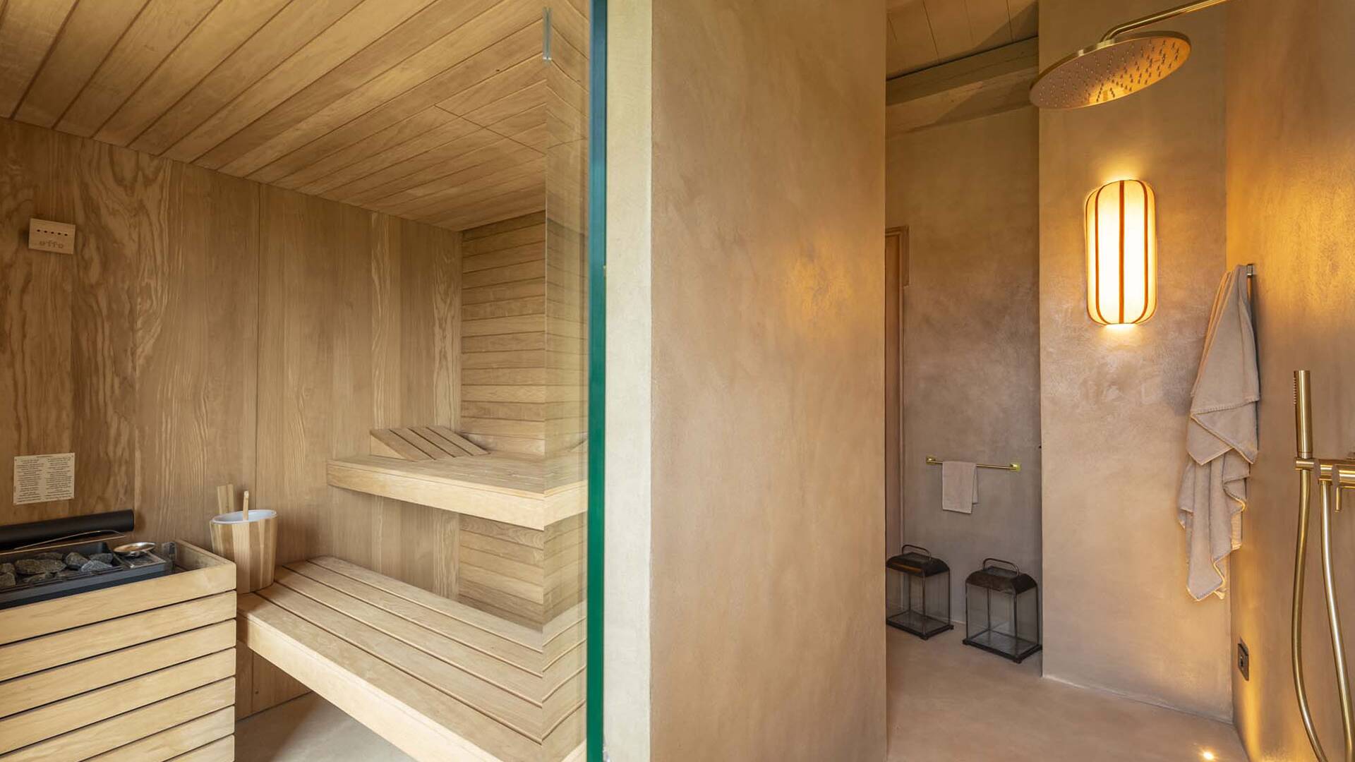 en suite bathroom with sauna and shower