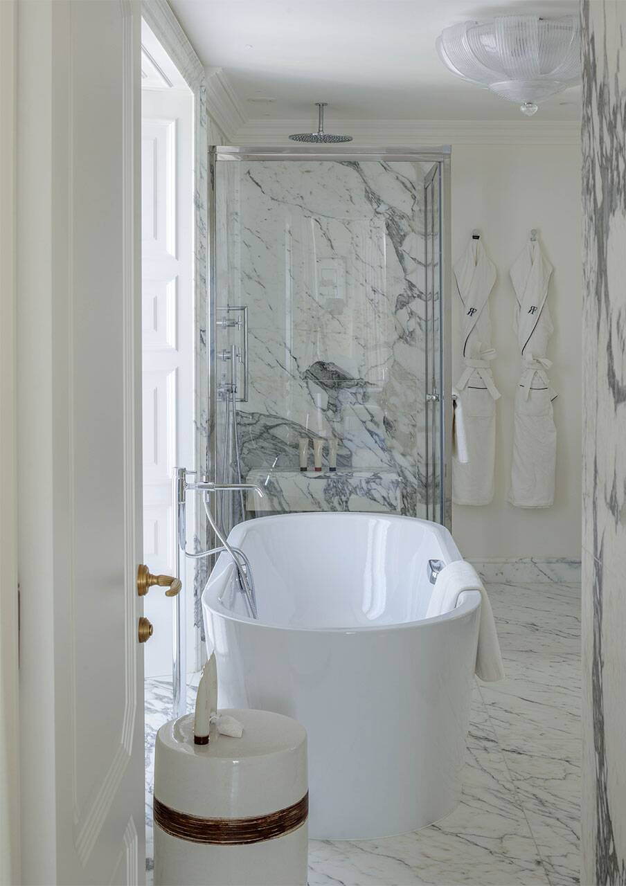 en suite bathroom with shower and bathtub