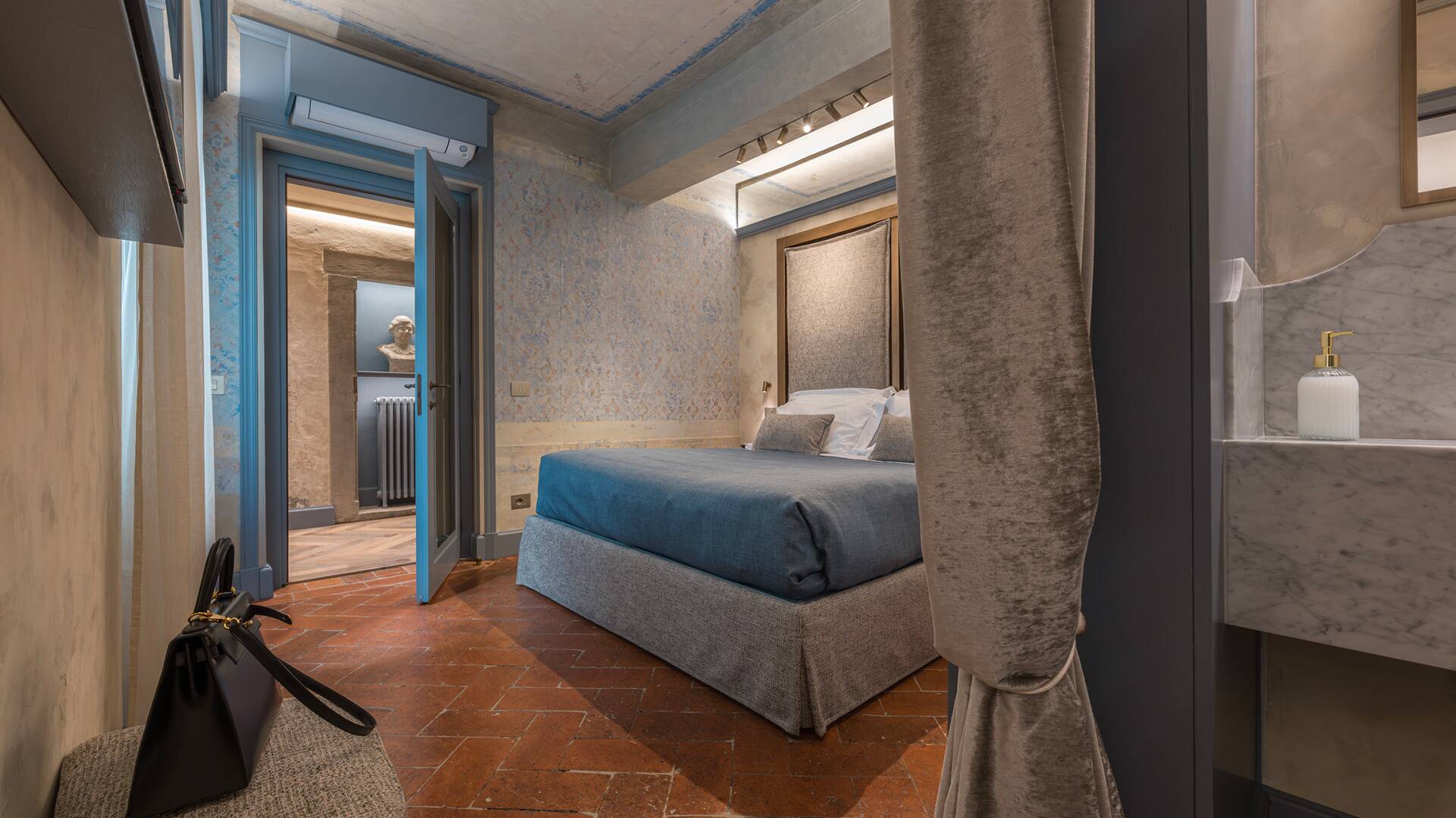 Stylish bedroom with warm parquet floors