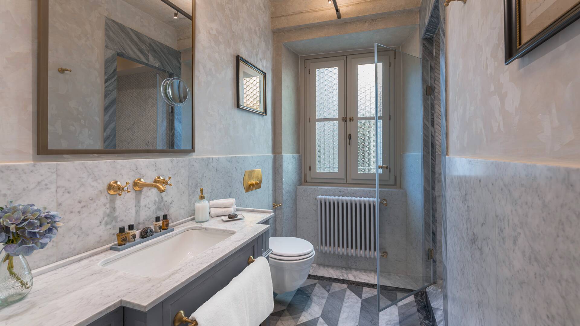 Elegant marble bathroom with natural light