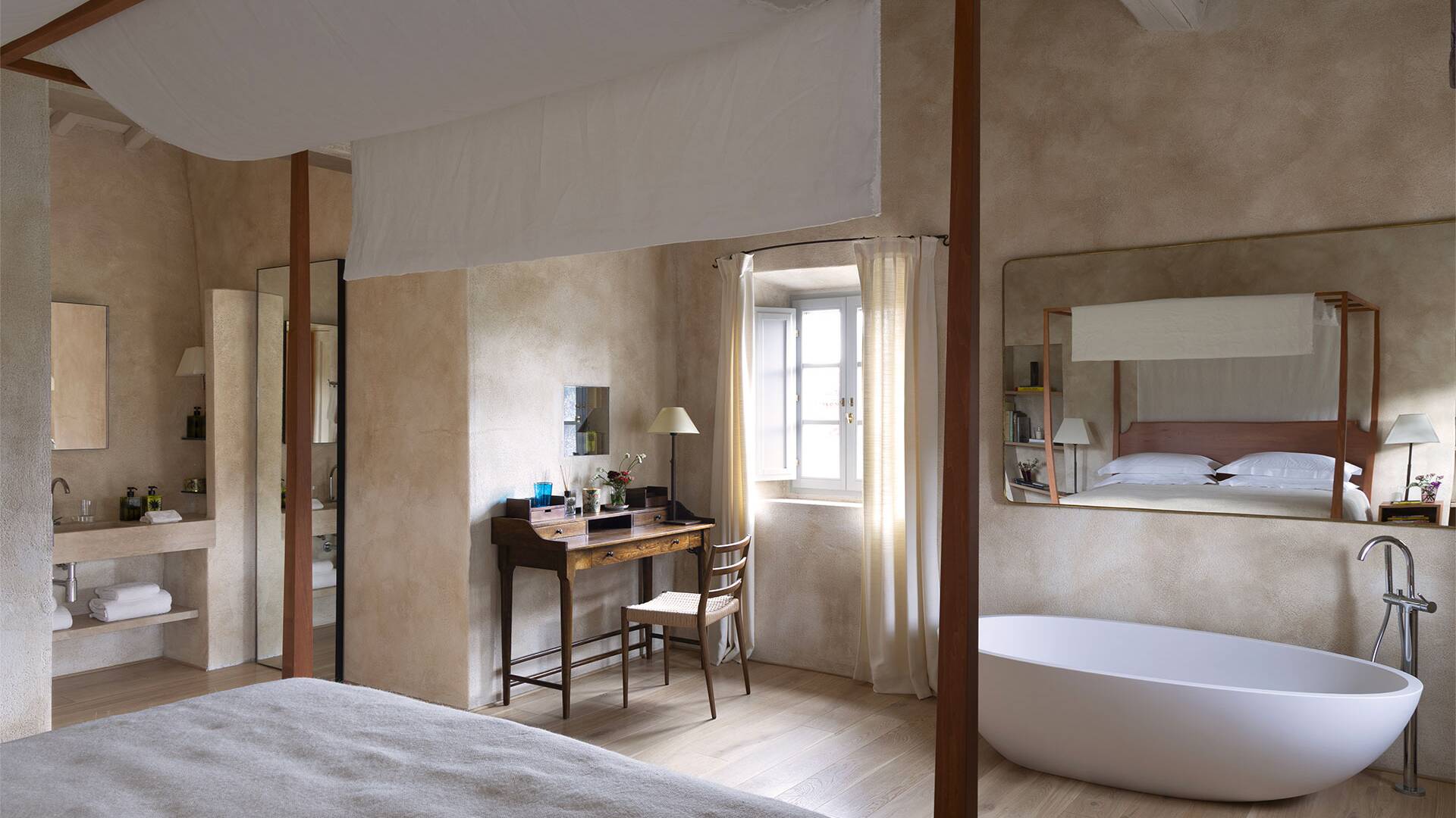 en suite double bedroom with bathtub