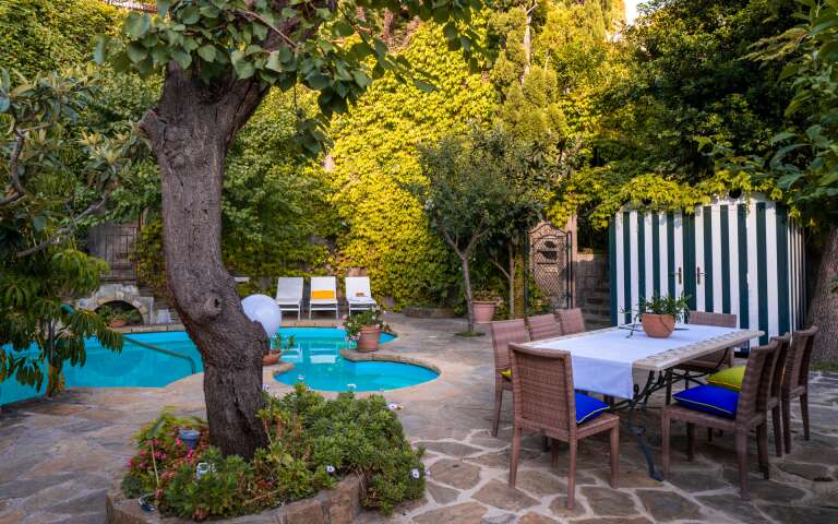 private swimming pool with dining table