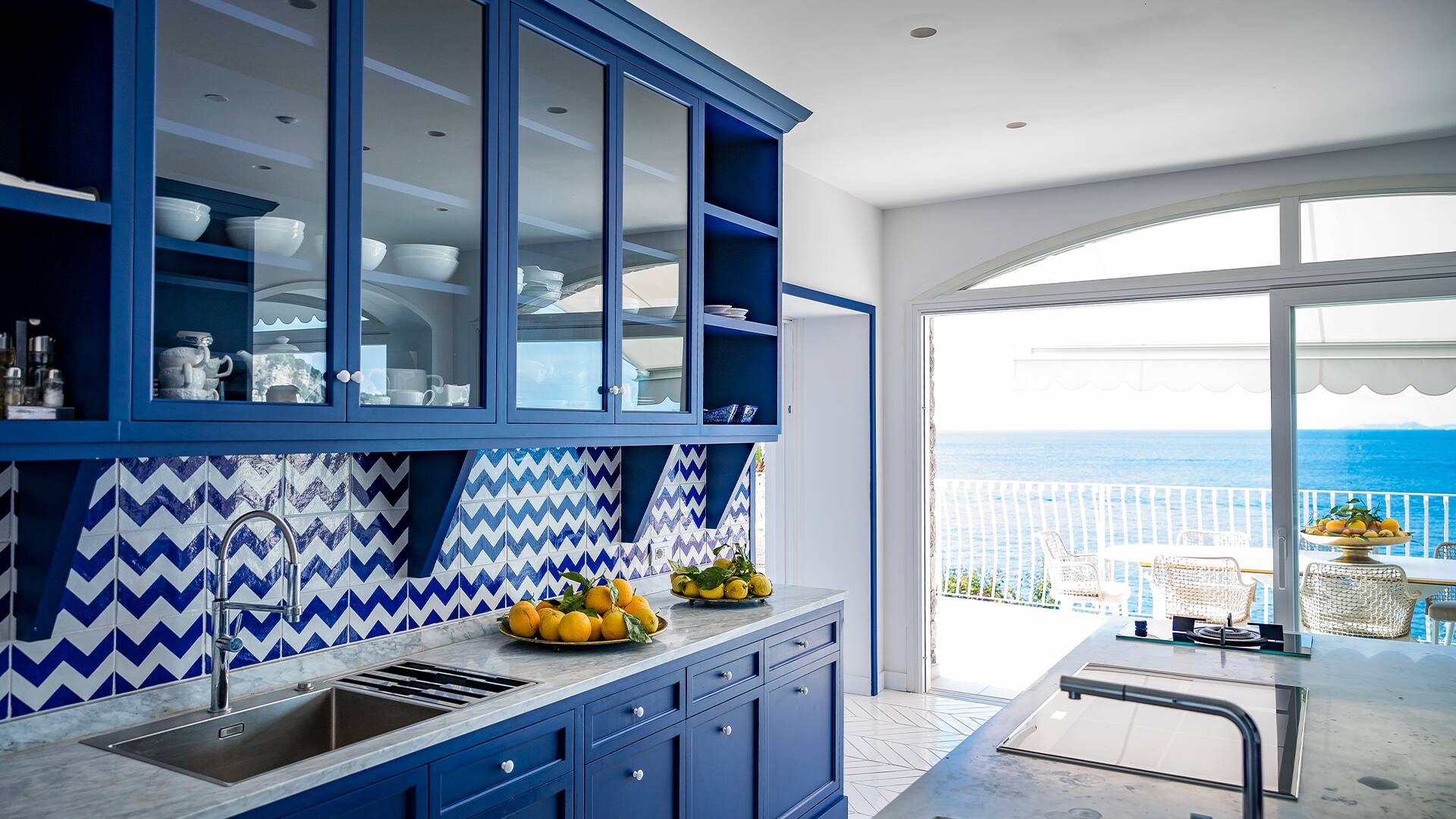 fully-equipped kitchen with access to covered pergola