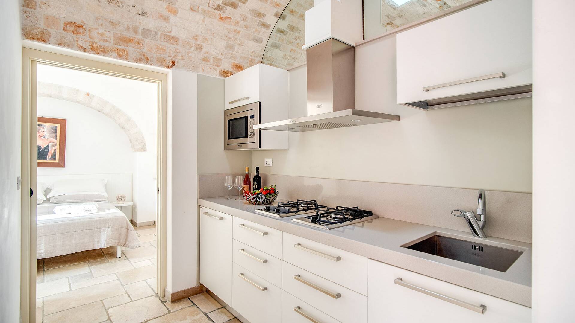 kitchen next to a double bedroom