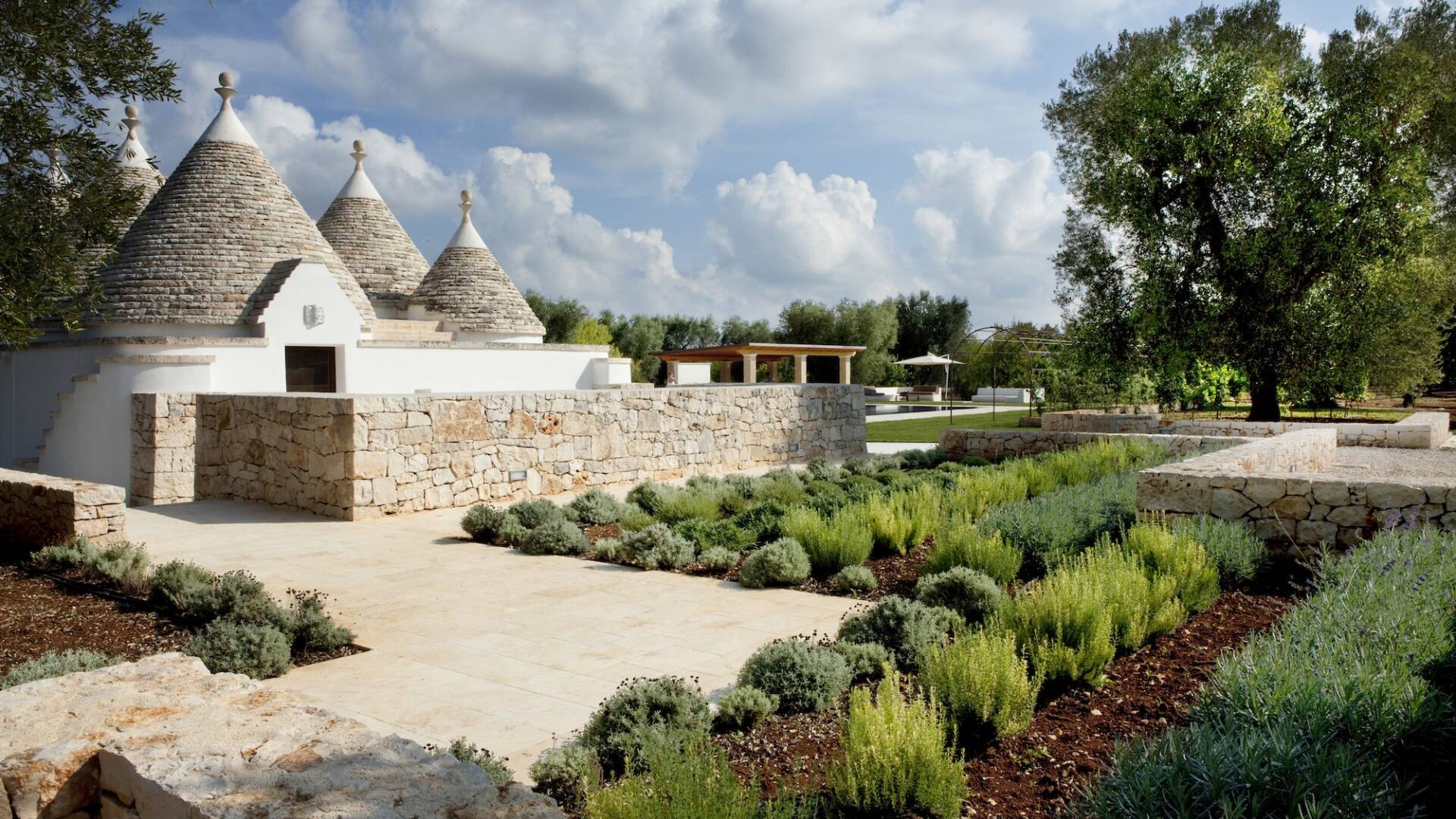 trulli surrounded by garden