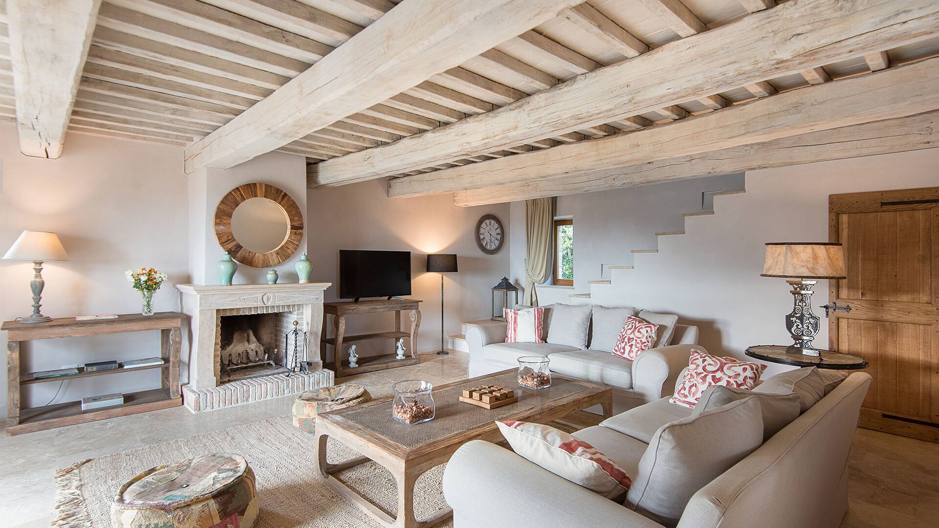 living room with TV and fireplace