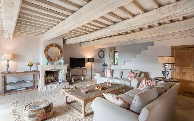 living room with TV and fireplace