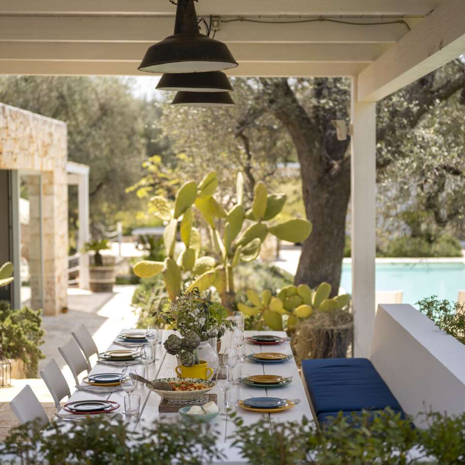 covered pergola with dining table