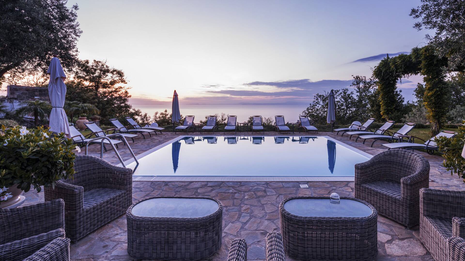 sunset over infinity swimming pool