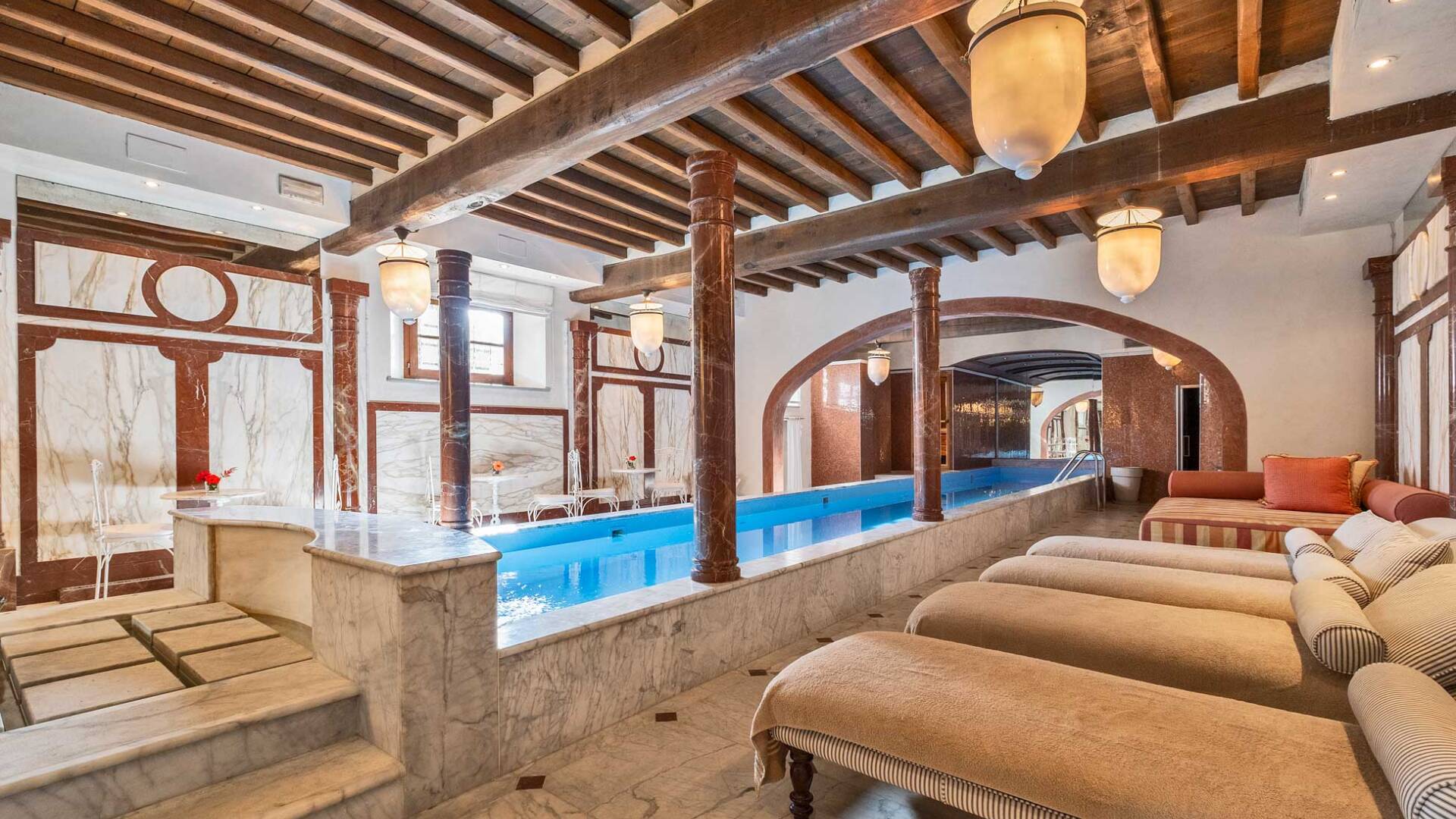 indoor pool with deckchairs