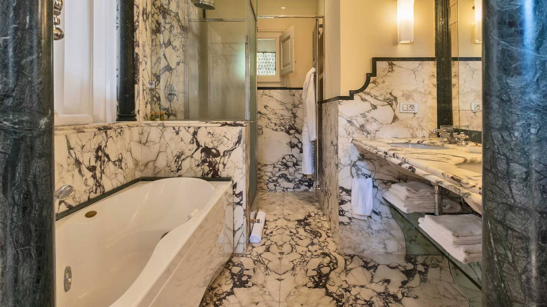 marble bathroom with bath tub