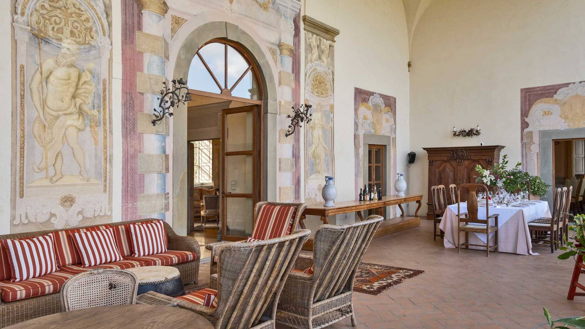 dining and sitting area with frescoes