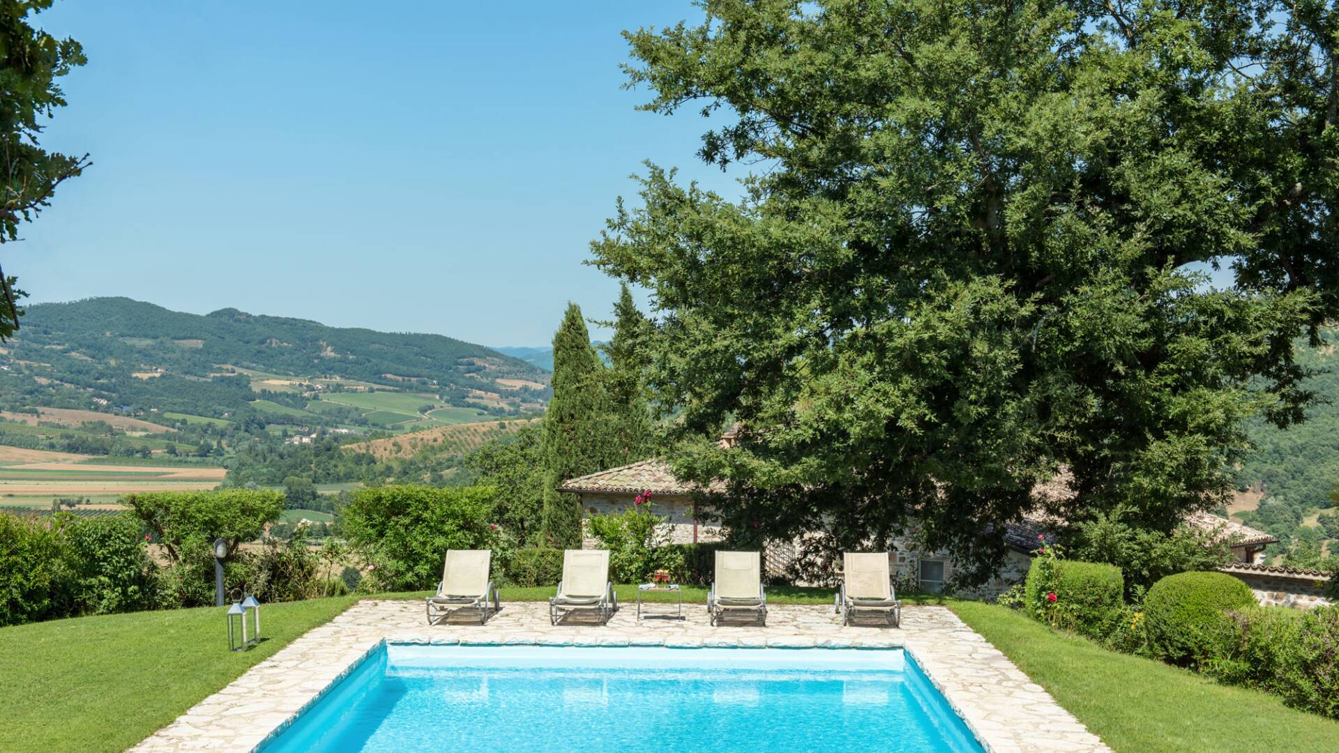 private swimming pool with sweeping view over rolling hills