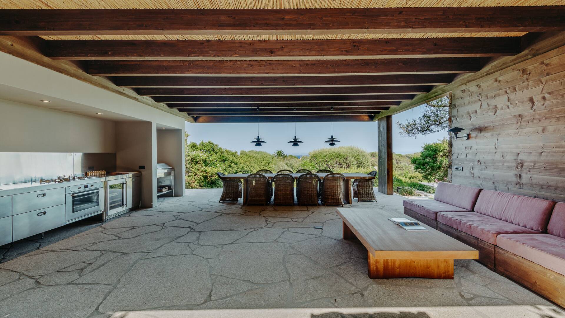 covered pergola with outdoor kitchen, living and dining area