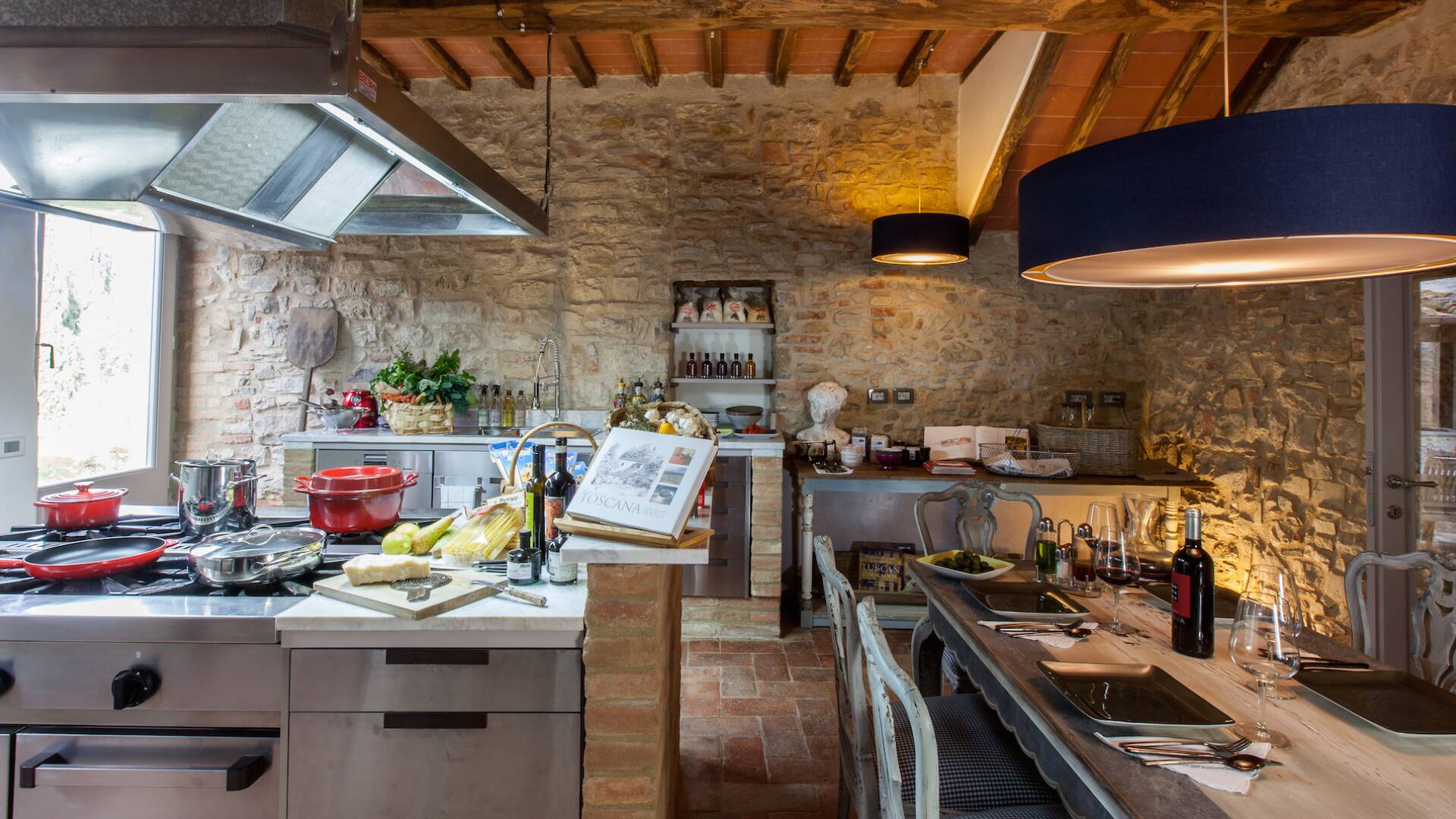 fully-equipped design kitchen with dining table