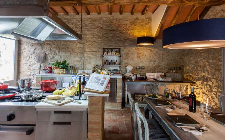 fully-equipped design kitchen with dining table