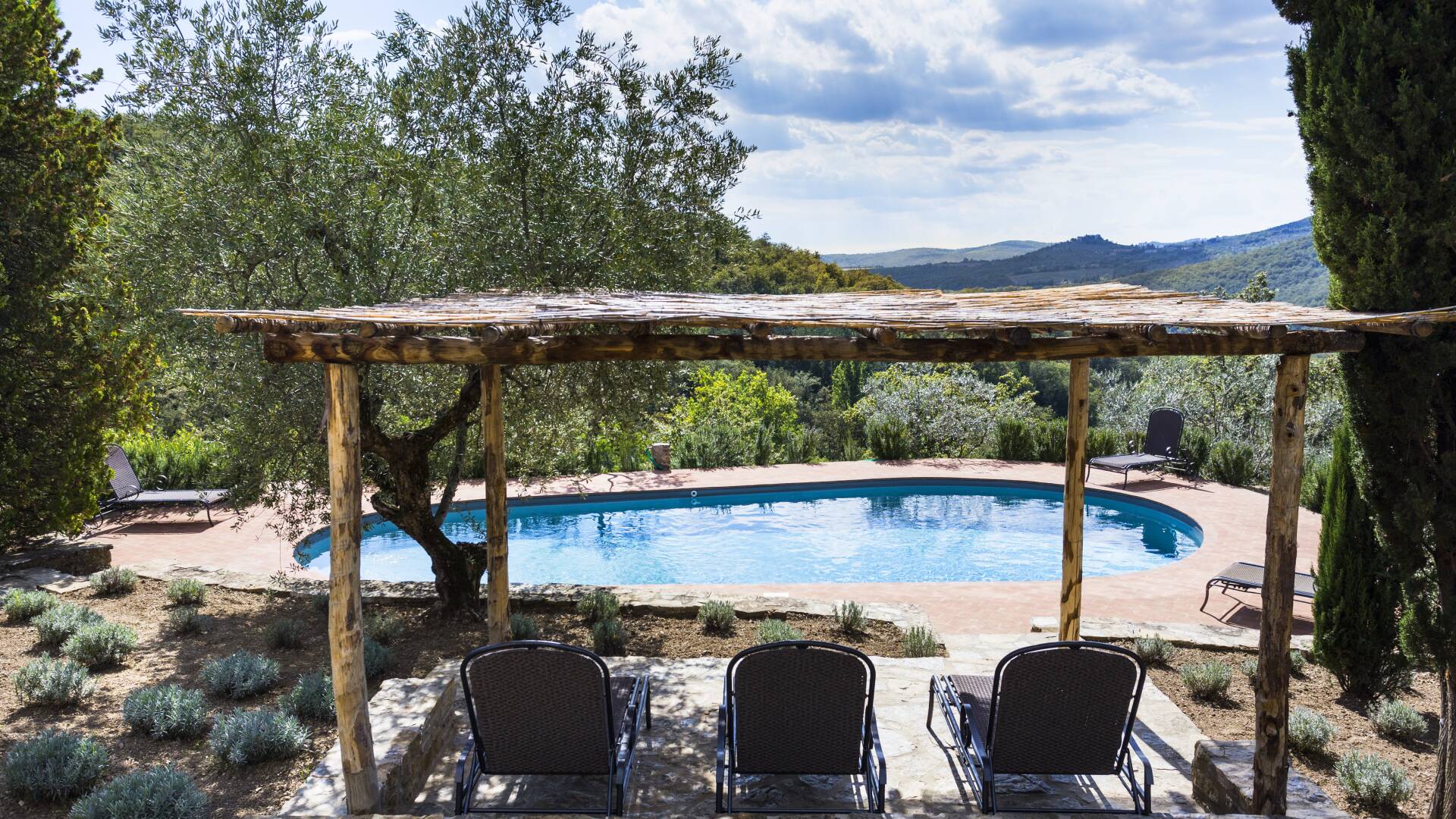 swimming pool with covered sunbathing area